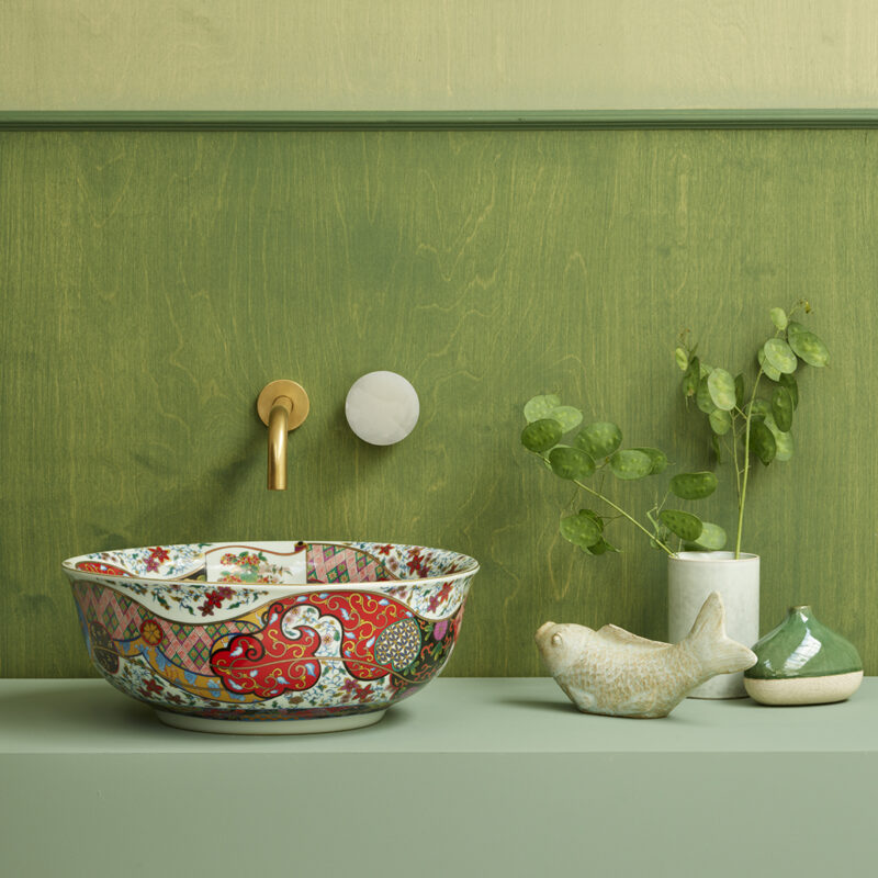 Melody basin against a green wall