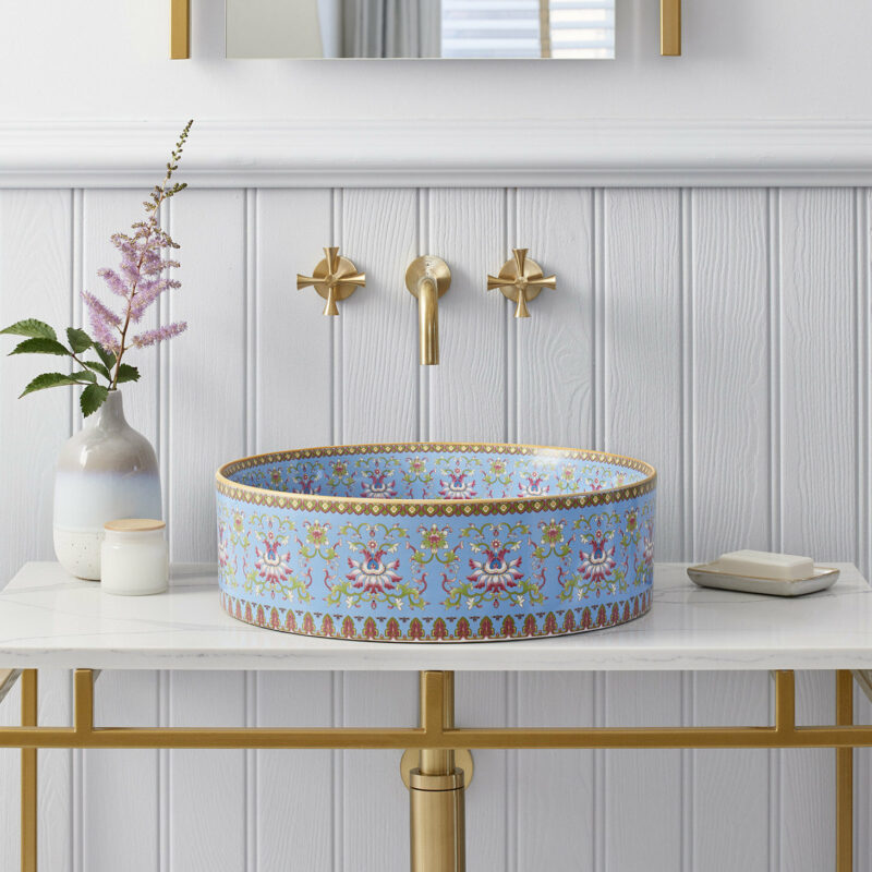 Marnie basin in white bathroom interior, paired with a Felix single vanity unit, Austin mirror in gold, Theo tap in brushed brass, and Theo Waste & Bottle Trap in brushed brass.