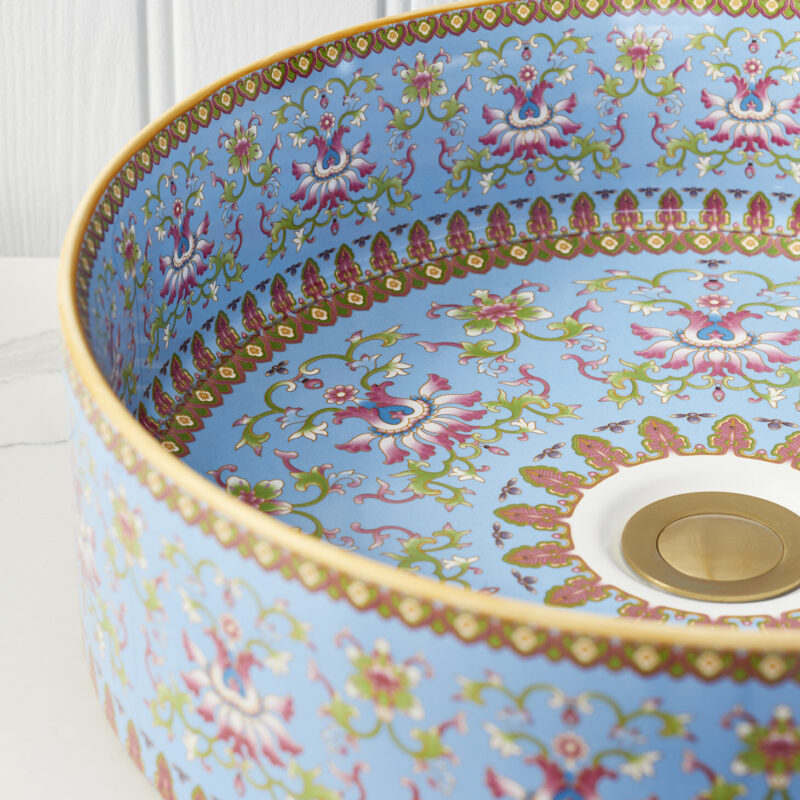 Close-up angled image of the Marnie basin in blue against a white bathroom interior.