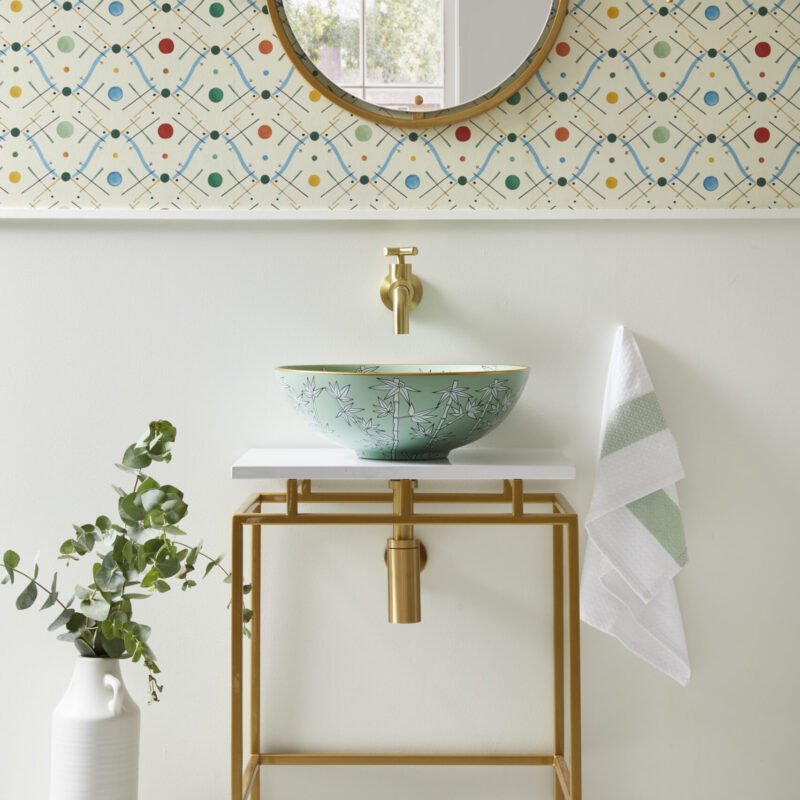 Sophia unique bathroom sink on top of Mini Felix Single Vanity Unit in gold and white surface, Oscar tap brushed gold, mini Felix venire unit, Arlo waste and bottle trap