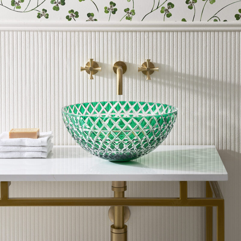 Lucia luxury basin in green glass with Theo Tap in brushed brass and Felix double vanity unit against in a white-interior bathroom.