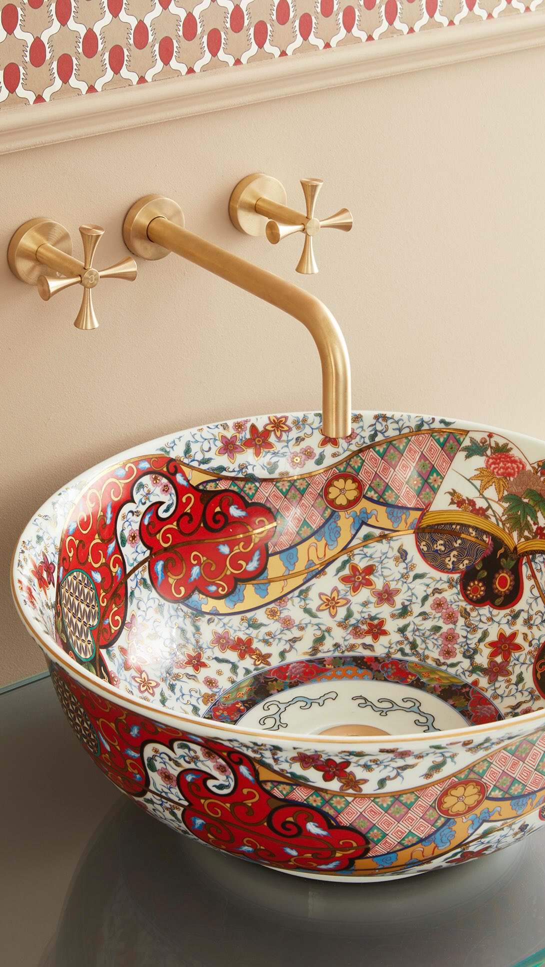 A bathroom full of colour, pattern and personality, featuring our Melody basin paired with the Theo...